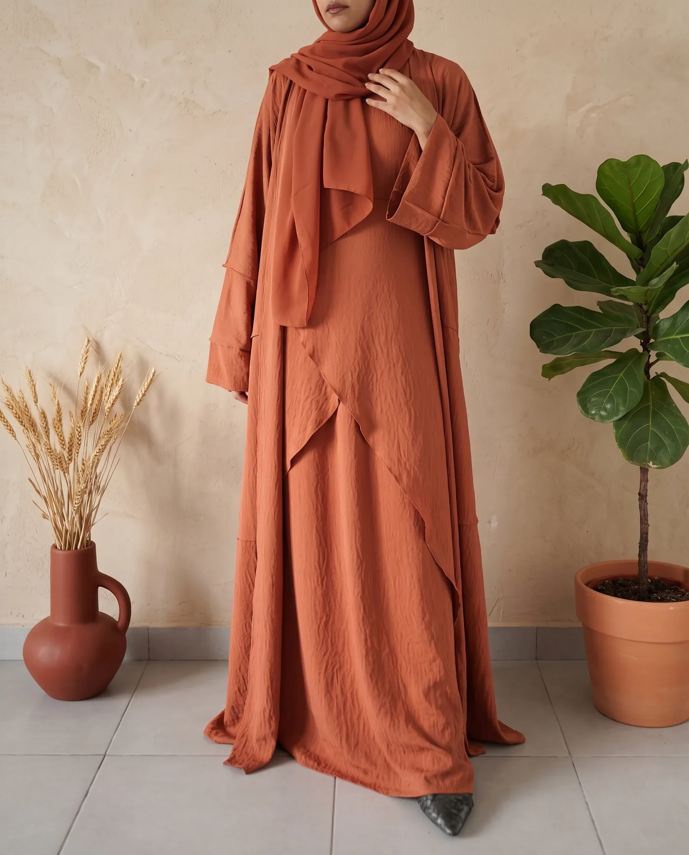 An occasion abaya in terracotta with a wide sleeve