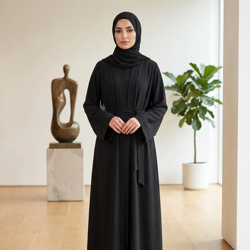 A nida crepe abaya in onyx, cut straight from the shoulder